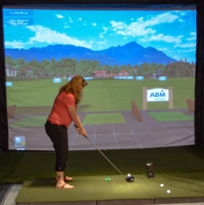 Women using golf simulator